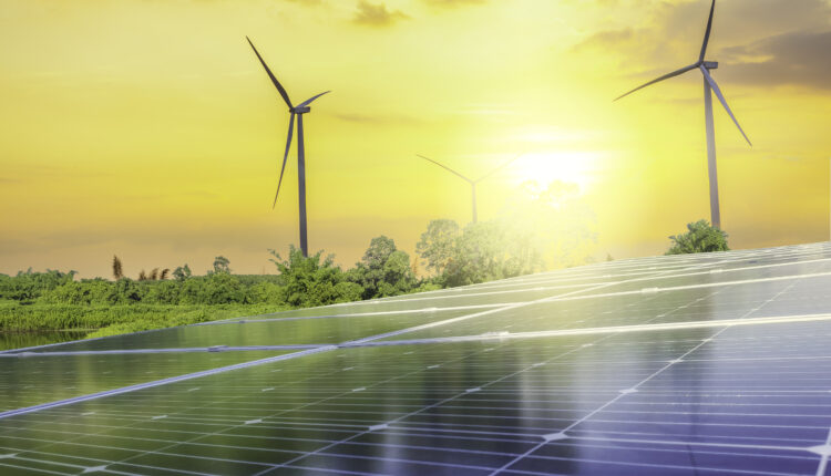 Decorative graphic of wind turbines and solar panels